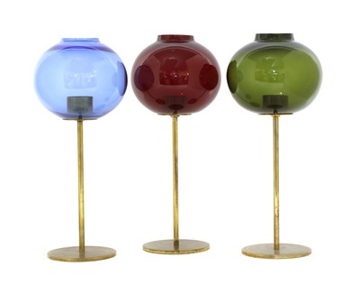 Lot 499 - Three brass 'L24/30' candlesticks