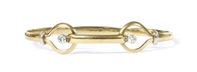 Lot 1102 - A 9ct gold diamond bangle