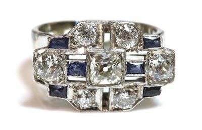 Lot 179 - An Art Deco diamond and sapphire stepped plaque ring, c.1935