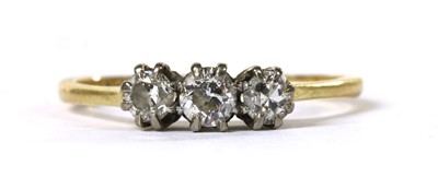 Lot 99 - A gold three stone diamond ring