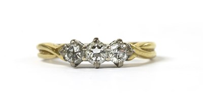 Lot 55 - An 18ct gold three stone diamond ring