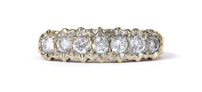 Lot 124 - A 9ct gold seven stone diamond ring