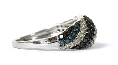 Lot 167 - A 9ct white gold diamond bombé ring