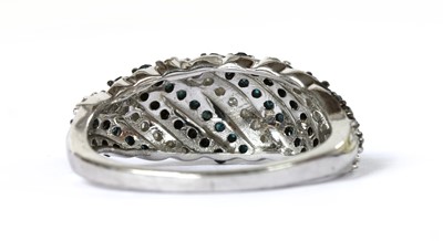 Lot 167 - A 9ct white gold diamond bombé ring