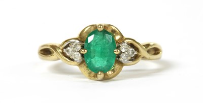 Lot 156 - A 9ct gold emerald and diamond ring