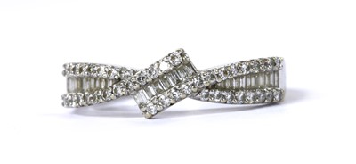 Lot 153 - An 18ct white gold diamond crossover ring