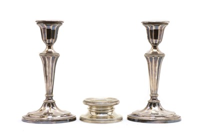 Lot 9 - A pair of silver candlesticks