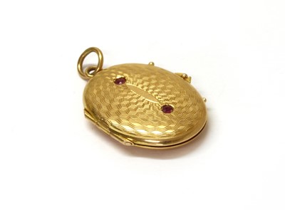Lot 222 - A gold ruby set locket