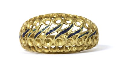 Lot 77 - A gold enamel pierced ring