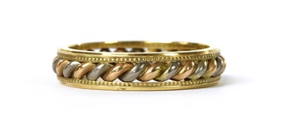Lot 1206 - An 18ct three colour gold band ring