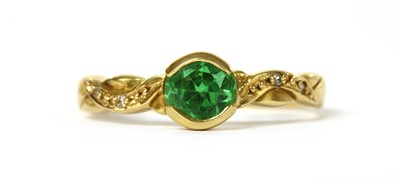 Lot 1199 - An 18ct gold garnet and diamond ring