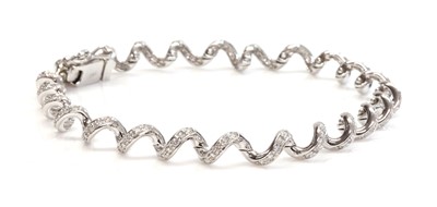 Lot 361 - An 18ct white gold diamond set spiral link bracelet