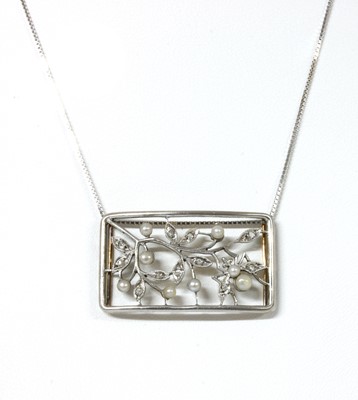Lot 1063 - An Edwardian gold and platinum, seed pearl and diamond buckle/slide