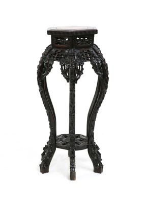 Lot 222 - A Chinese hardwood vase stand