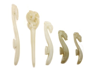 Lot 104 - A collection of four Chinese jade belt hooks