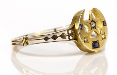Lot 136 - An Edwardian sapphire and diamond closed crescent and star bangle, c.1905