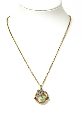Lot 48 - An Edwardian gold ruby, pearl and enamel floral pendant