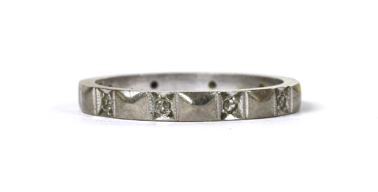 Lot 149 - A white gold diamond set band ring