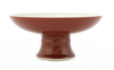 Lot 393 - A Chinese copper-red glazed stem plate