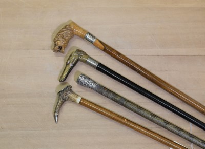 Lot 66 - A group of four walking sticks
