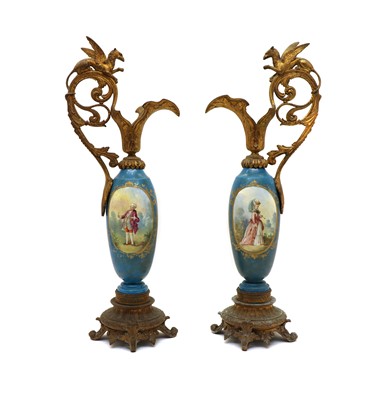 Lot 95 - A pair of single handled Sèvres style vases