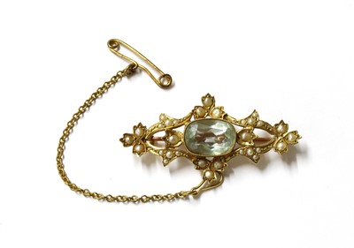 Lot 40 - An Edwardian gold aquamarine and split pearl brooch