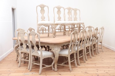 Lot 24 - A large limed oak dining table