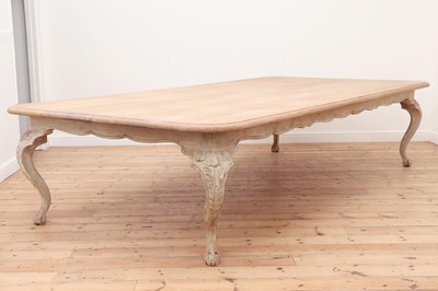 Lot 24 - A large limed oak dining table