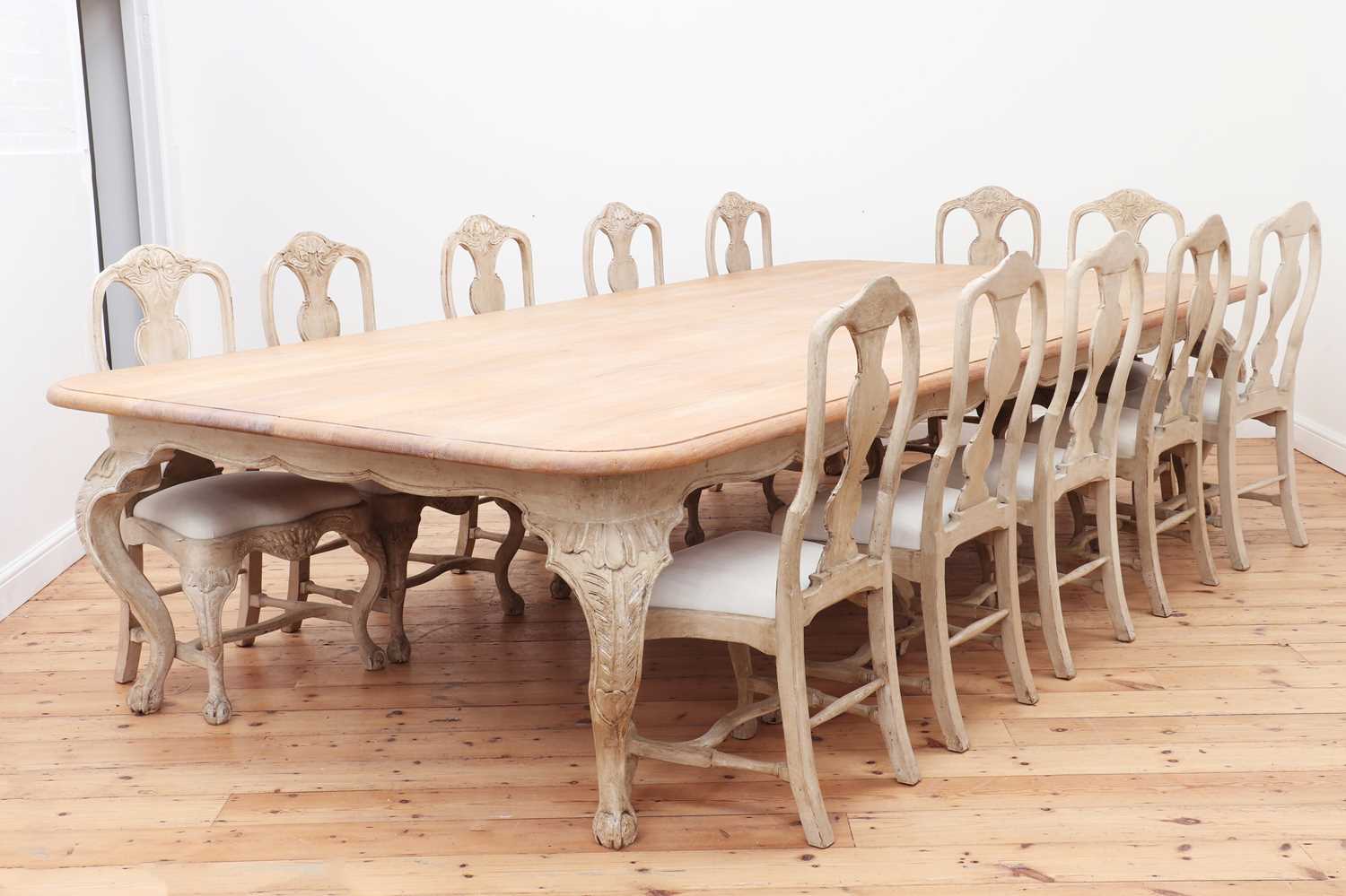 Lot 24 - A large limed oak dining table