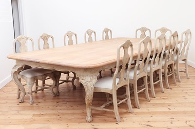 Lot 24 - A large limed oak dining table