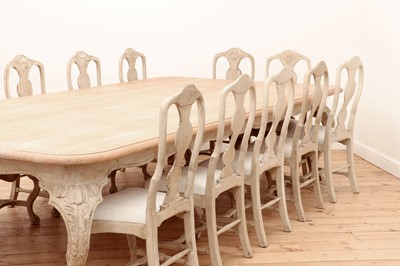 Lot 24 - A large limed oak dining table