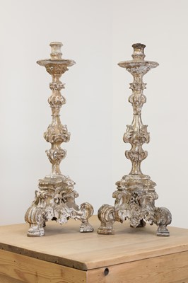 Lot 25 - A pair of baroque carved giltwood candlestands