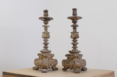 Lot 26 - A pair of baroque carved giltwood candlestands