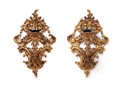 Lot 30 - A pair of large giltwood wall appliqués