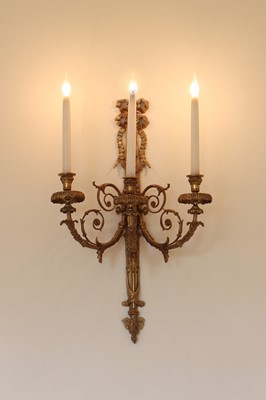 Lot 33 - A pair of gilt three-light wall lights