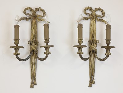 Lot 57 - A pair of gilt-bronze twin-branch wall lights