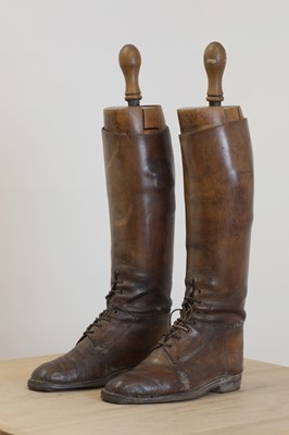 Lot 100 - A pair of leather riding boots