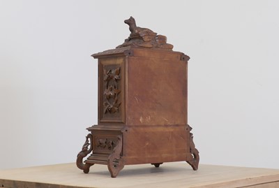 Lot 150 - A Black Forest carved wooden table cabinet