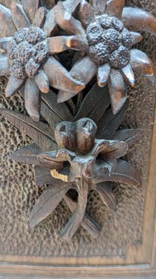 Lot 150 - A Black Forest carved wooden table cabinet