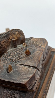 Lot 150 - A Black Forest carved wooden table cabinet