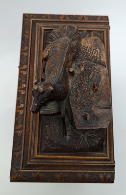 Lot 150 - A Black Forest carved wooden table cabinet
