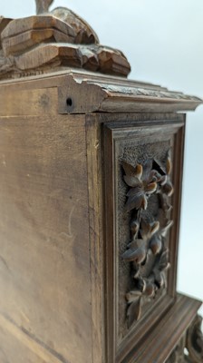 Lot 150 - A Black Forest carved wooden table cabinet