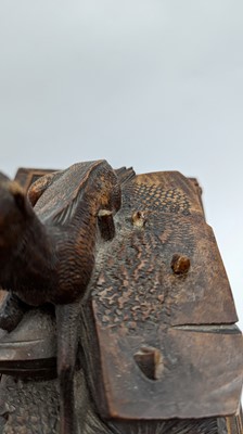 Lot 150 - A Black Forest carved wooden table cabinet