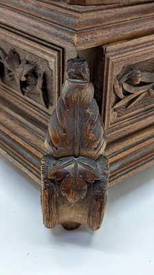 Lot 150 - A Black Forest carved wooden table cabinet