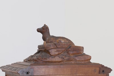 Lot 150 - A Black Forest carved wooden table cabinet