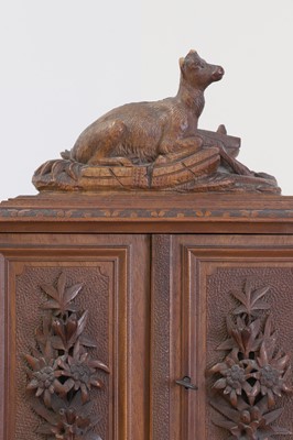 Lot 150 - A Black Forest carved wooden table cabinet
