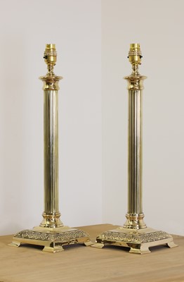 Lot 258 - A pair of brass candlestick lamps
