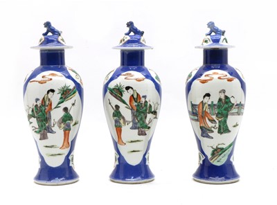 Lot 132 - A set of three Chinese blue and white vases and covers