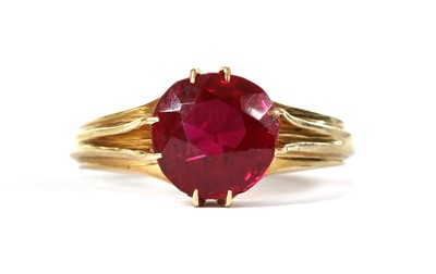 Lot 215 - A gold single stone synthetic ruby ring