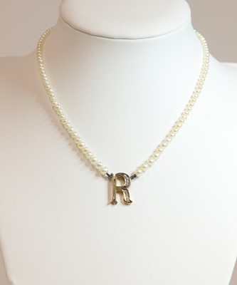 Lot 302 - A single row pearl and diamond initial necklace